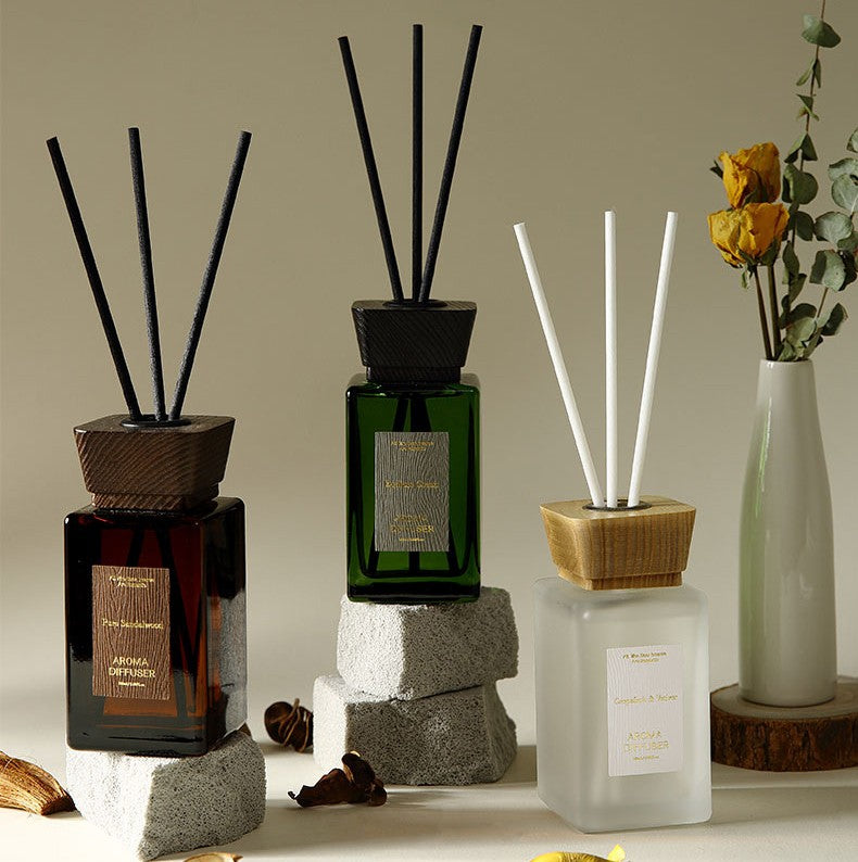Collection of diffusers with sticks on a neutral background
