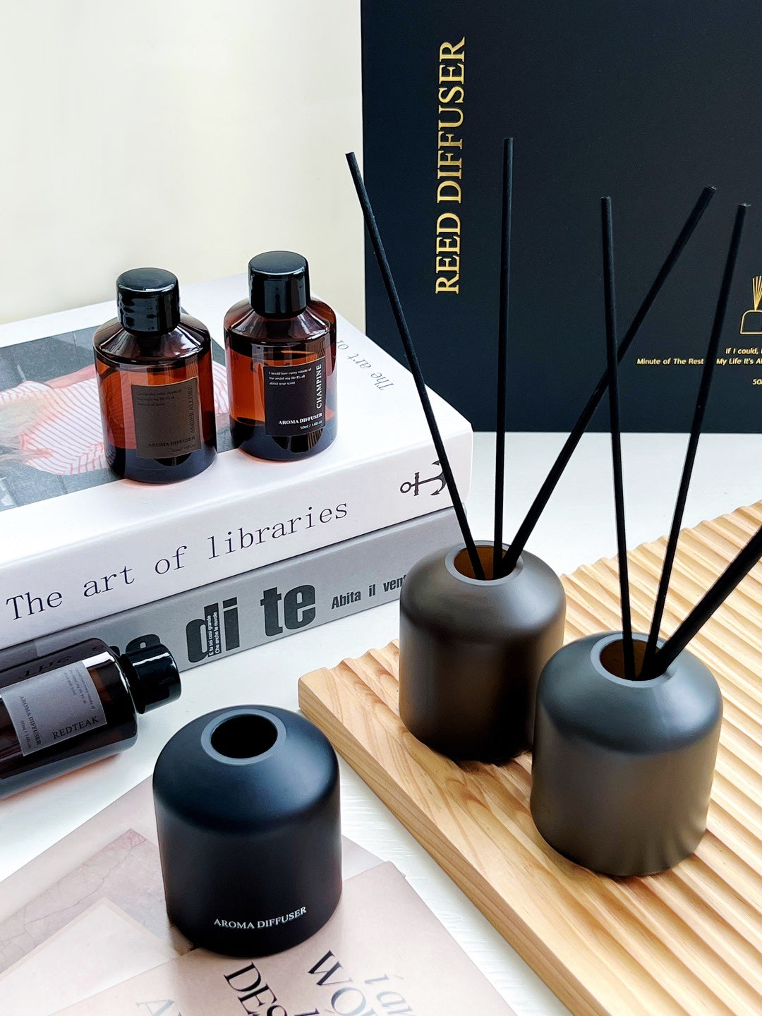 Reed diffuser set with bottles and packaging on a surface