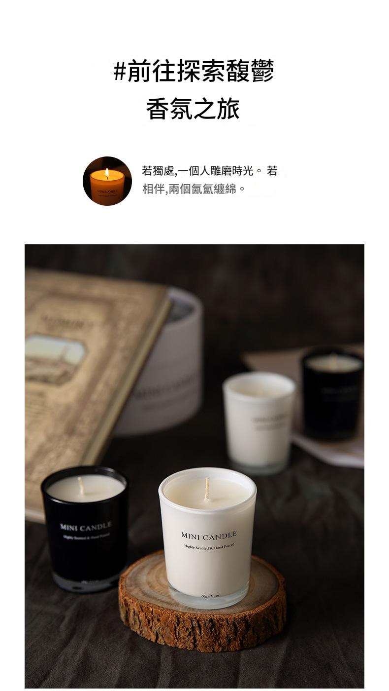 Candles on a wooden stand with a blurred background featuring books and a cup.