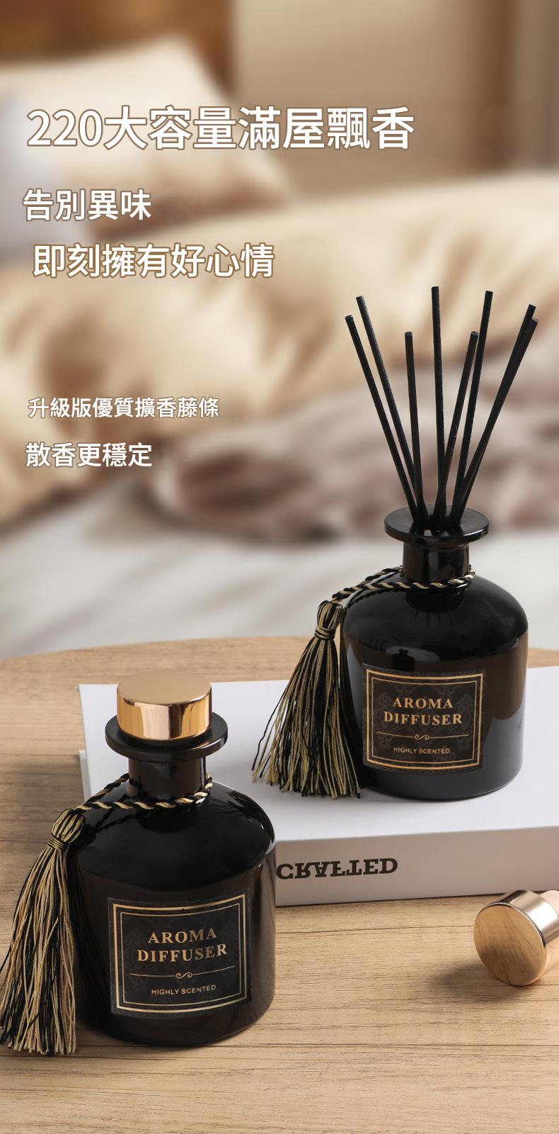 Two black aroma diffusers on a wooden surface with a blurred background