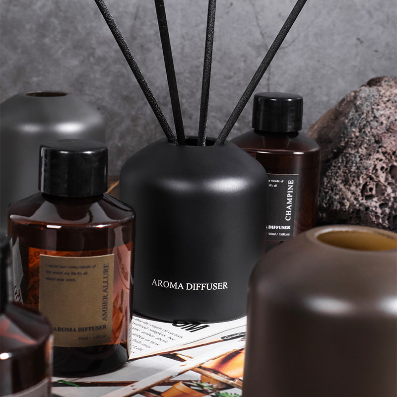 Collection of diffusers and bottles on a textured surface