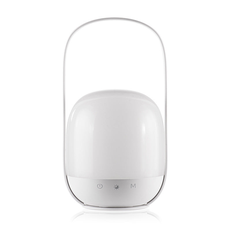 White cylindrical device with a transparent top on a white background