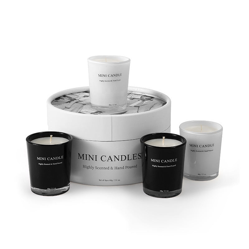 Set of mini candles with a marble-patterned display box on a white background