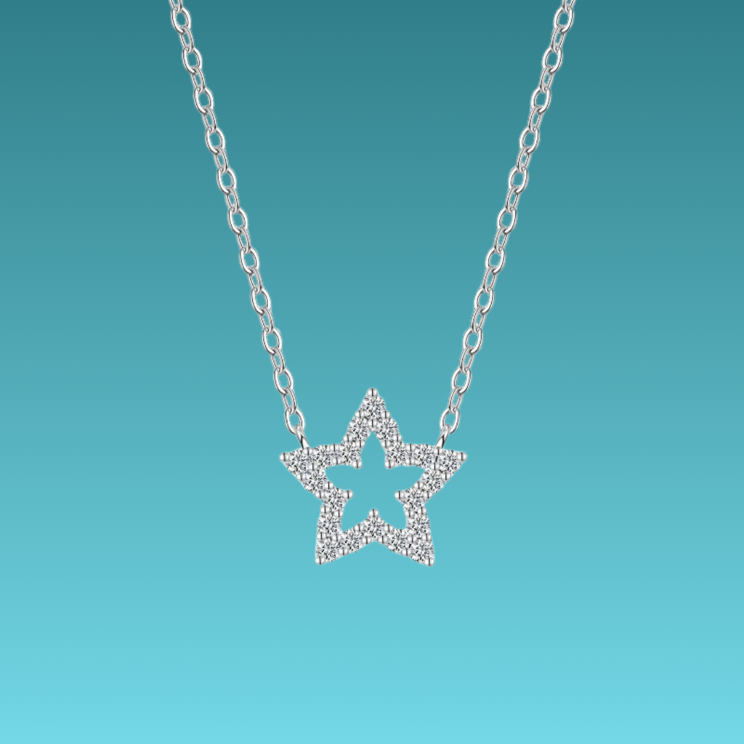 Star-shaped silver necklace on a turquoise background