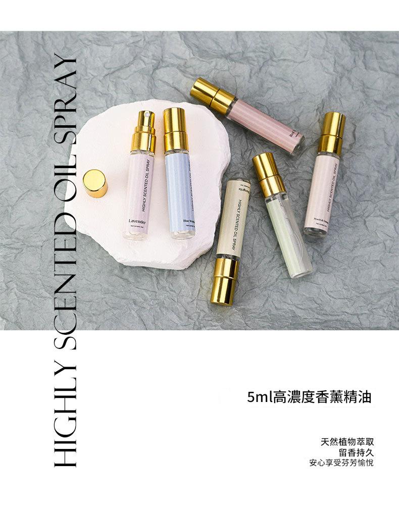 Set of small perfume bottles with gold caps on a textured gray background