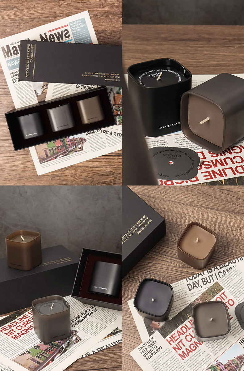 Collage of candles in various packaging on a wooden surface with newspaper.