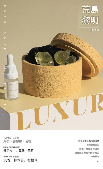 Cosmetic set with a textured container, dropper bottle, and crystals on a beige background.