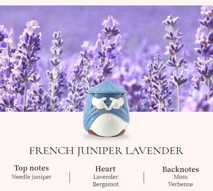 Small blue and white container with lavender flowers in the background