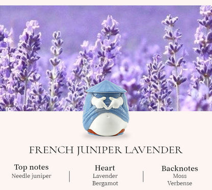 Small blue and white container with lavender flowers in the background
