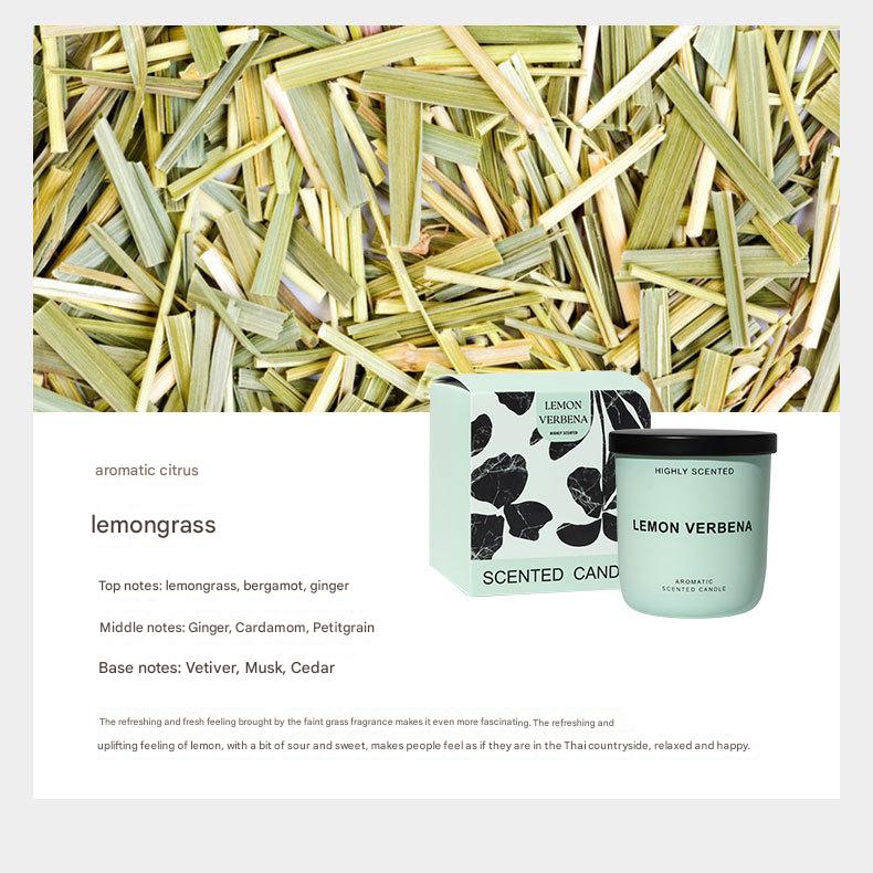 Lemongrass scented candle with product packaging on a background of lemongrass stalks.