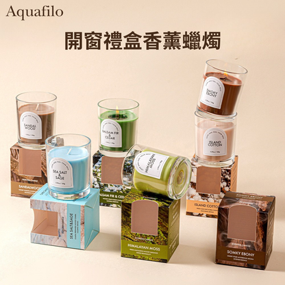 Collection of candles with labels and boxes on a beige background, featuring the brand 'Aquafilo'.