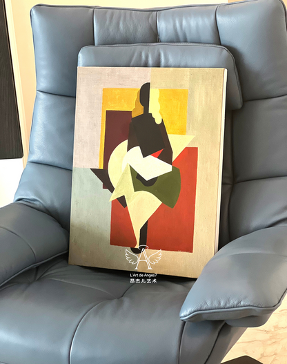 Abstract art piece on a gray leather chair