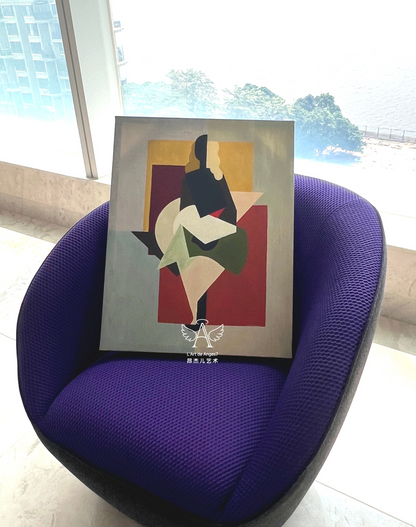 Framed abstract artwork on a purple chair with a window in the background