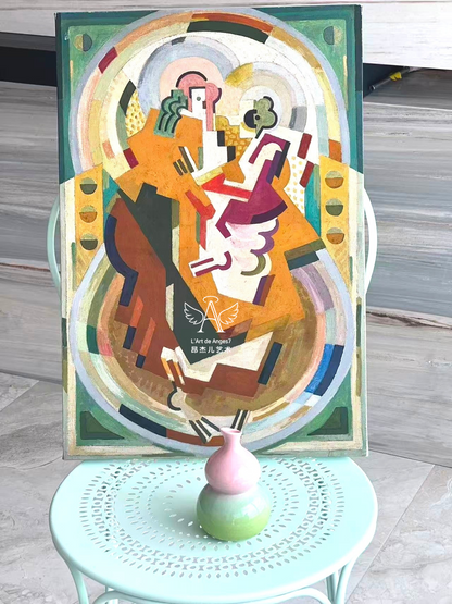Colorful abstract painting on a table with a vase