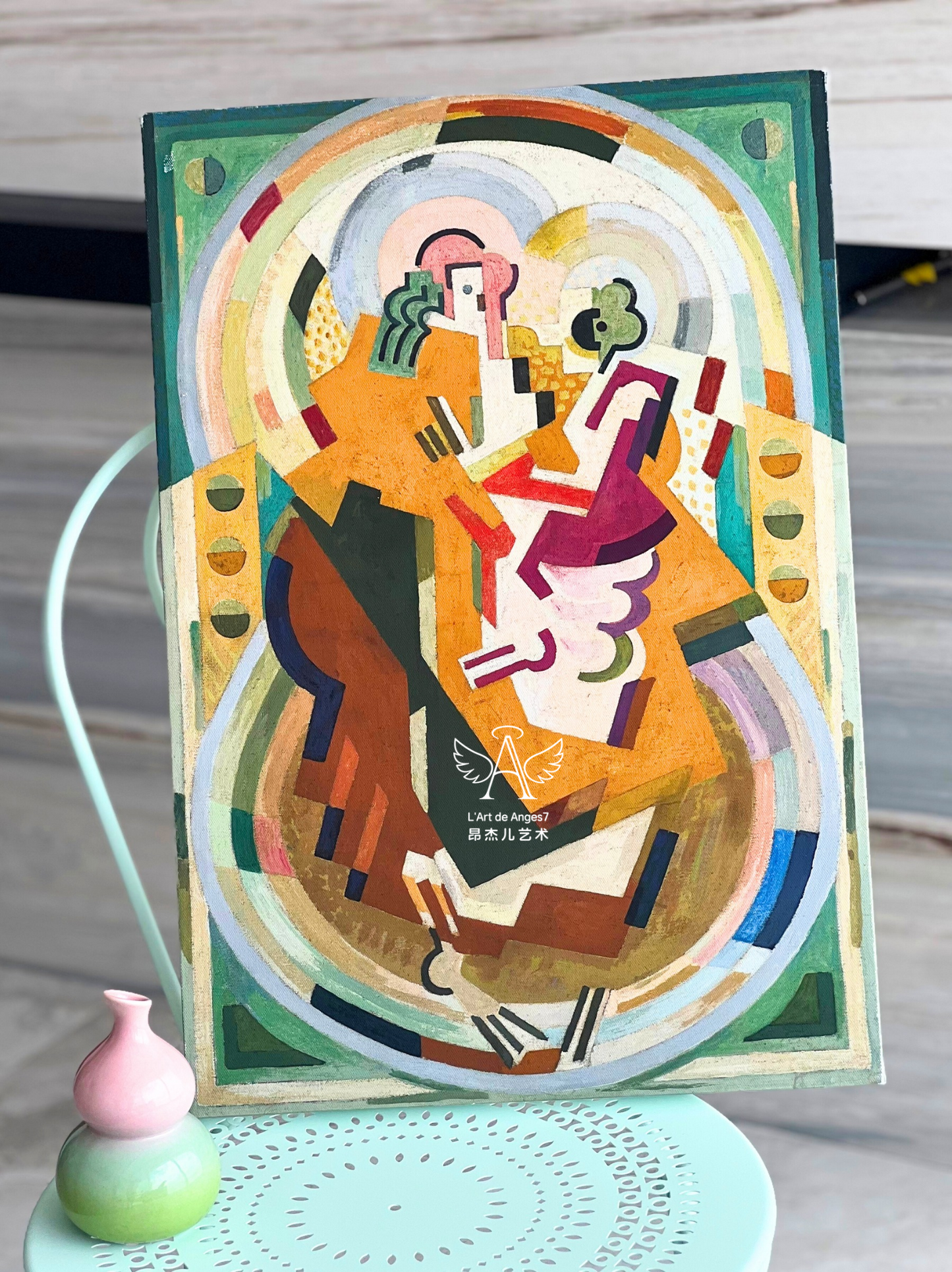 Colorful abstract artwork on a stand with a blurred background