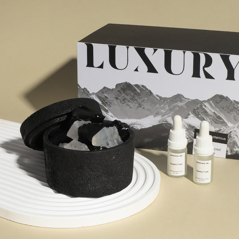 Black container with white contents, two dropper bottles, and a 'Luxury' branded box on a beige surface.