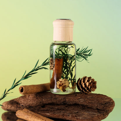 Glass bottle with natural elements on a wooden surface against a green background