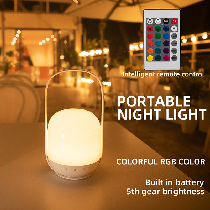 Portable night light with remote control on a blurred outdoor background