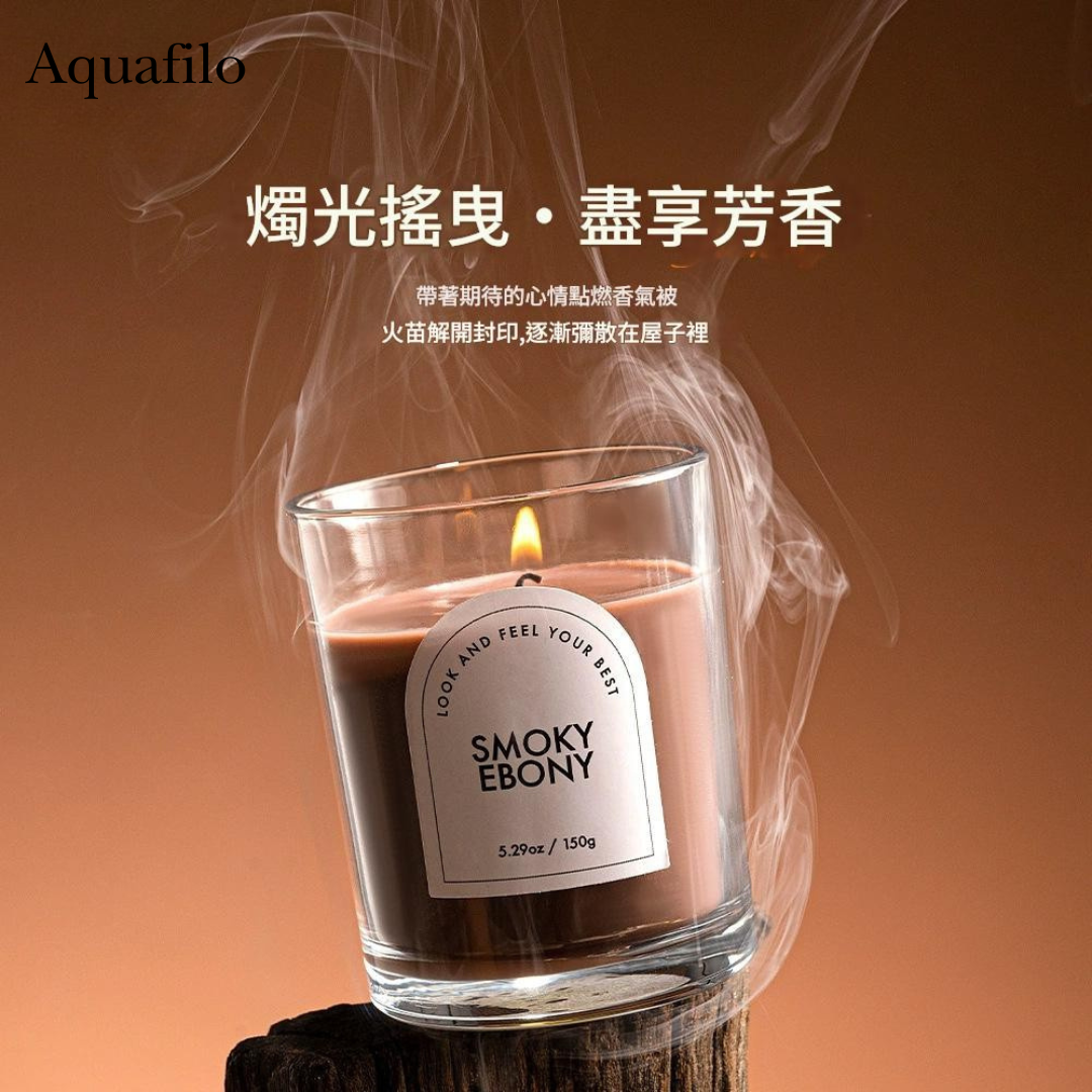 Candle labeled 'Smoky Ebony' with smoke effect on a brown background, featuring the brand 'Aquafilo'.