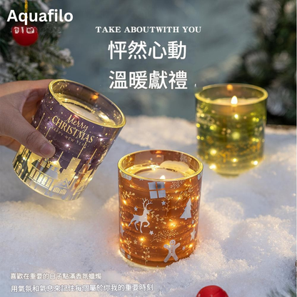 Decorative candles with Christmas design in snow, featuring Aquafilo branding.
