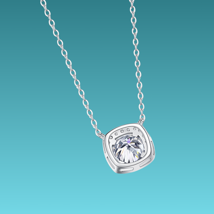 Silver necklace with a diamond pendant on a teal background