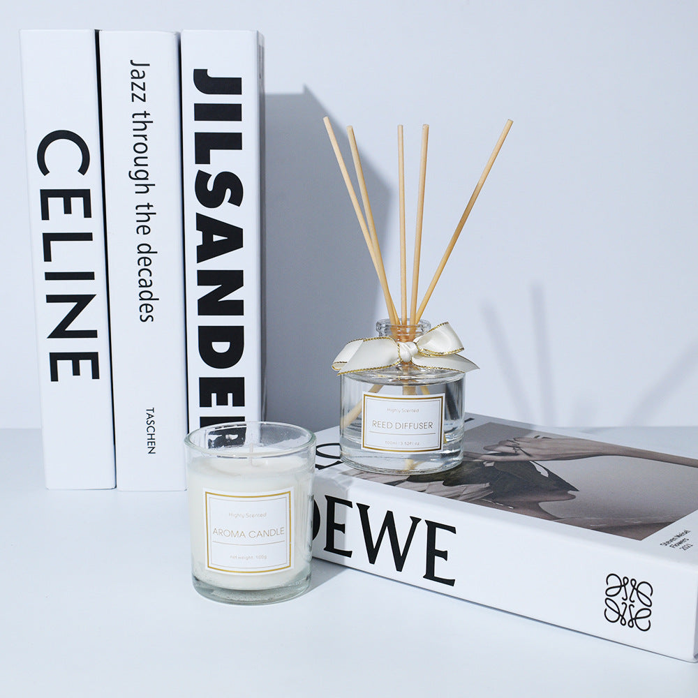 Candle and diffuser with books in the background