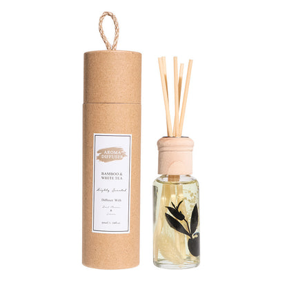 Aroma Diffuser bamboo & white tea diffuser with glass bottle and wooden sticks on a white background