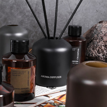 Collection of diffusers and bottles on a textured surface
