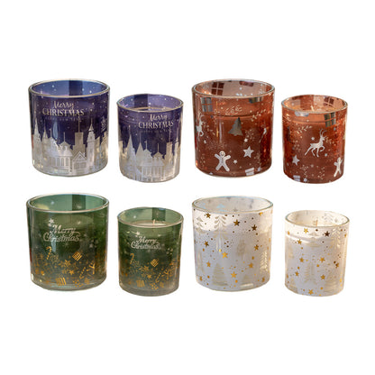 Set of decorative candle holders with Christmas designs on a white background