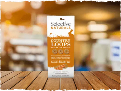 Selective Naturals Country Loops snack package on a wooden surface with a blurred background