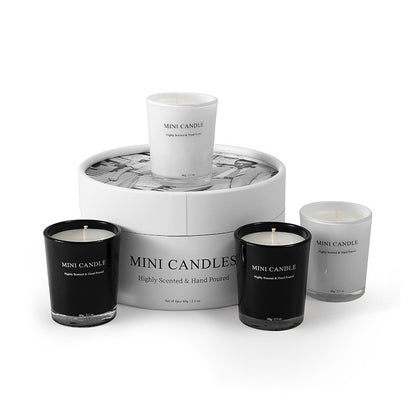 Set of mini candles with a marble-patterned display box on a white background