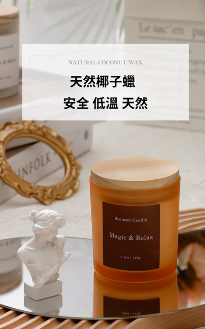 Candle with wooden lid on a reflective surface, surrounded by decorative items.