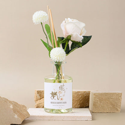 Reed diffuser with flowers on a neutral background