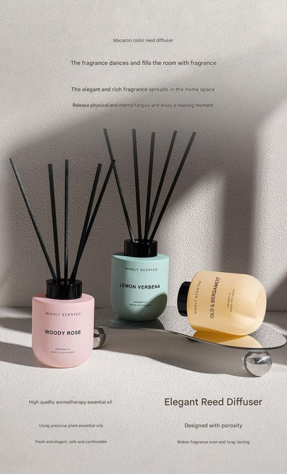 Three reed diffusers on a light surface with a neutral background