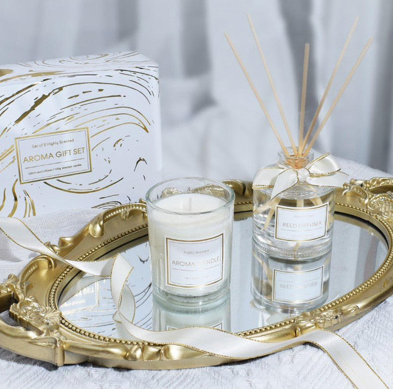 Aroma gift set with candle and diffuser on a decorative tray