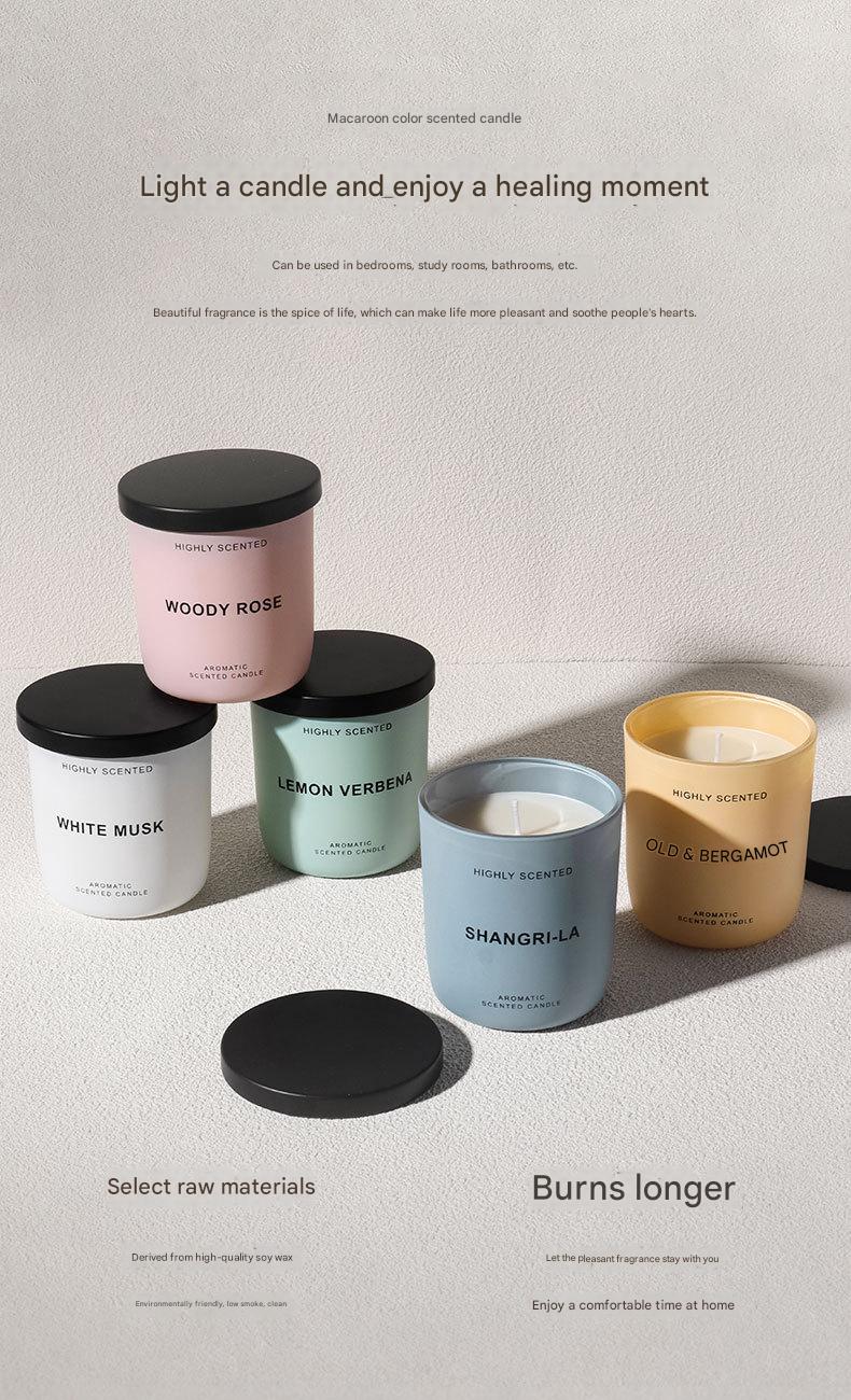Collection of candles with various scents on a neutral background