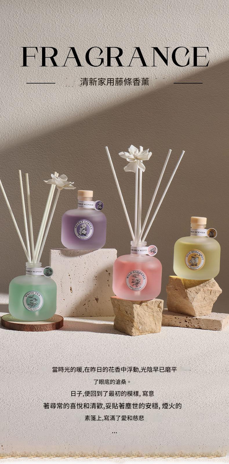 Set of diffusers and bottles with decorative elements on a neutral background