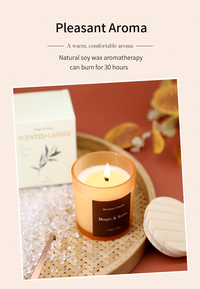 Scented candle with packaging on a decorative surface
