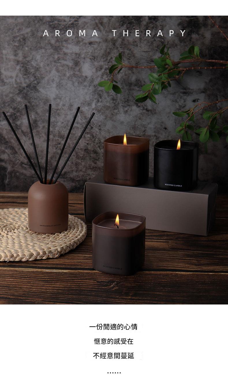 Aromatherapy setup with candles, diffuser, and text on a dark background