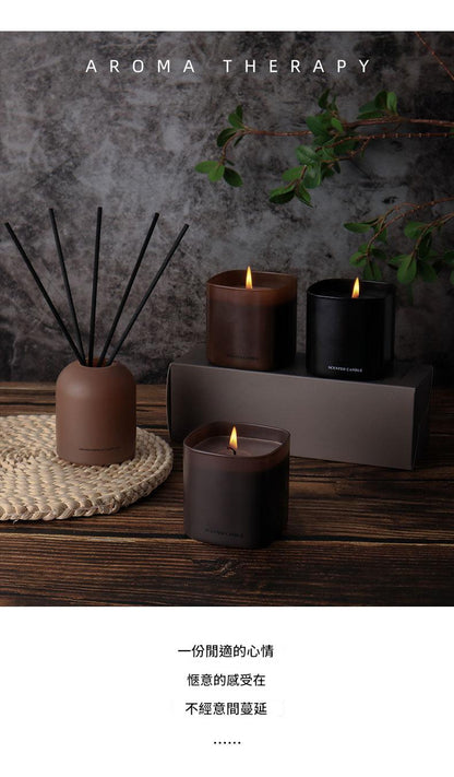 Aromatherapy setup with candles, diffuser, and text on a dark background