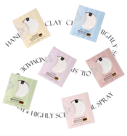 Set of six small bottles with different colored packaging on a white background