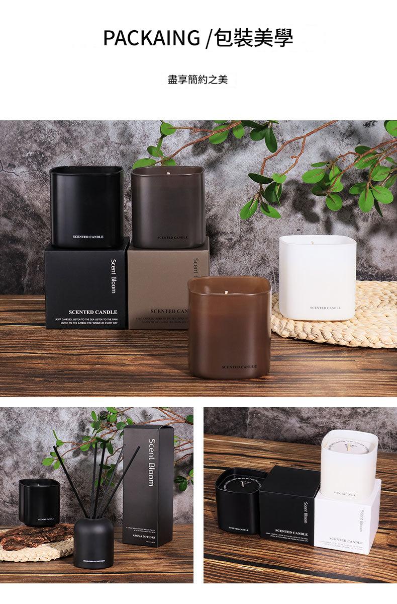 Candles and packaging displayed on a wooden surface with a natural background